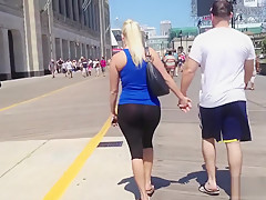 gorgeous blonde girl walking the streets in see through yoga pants